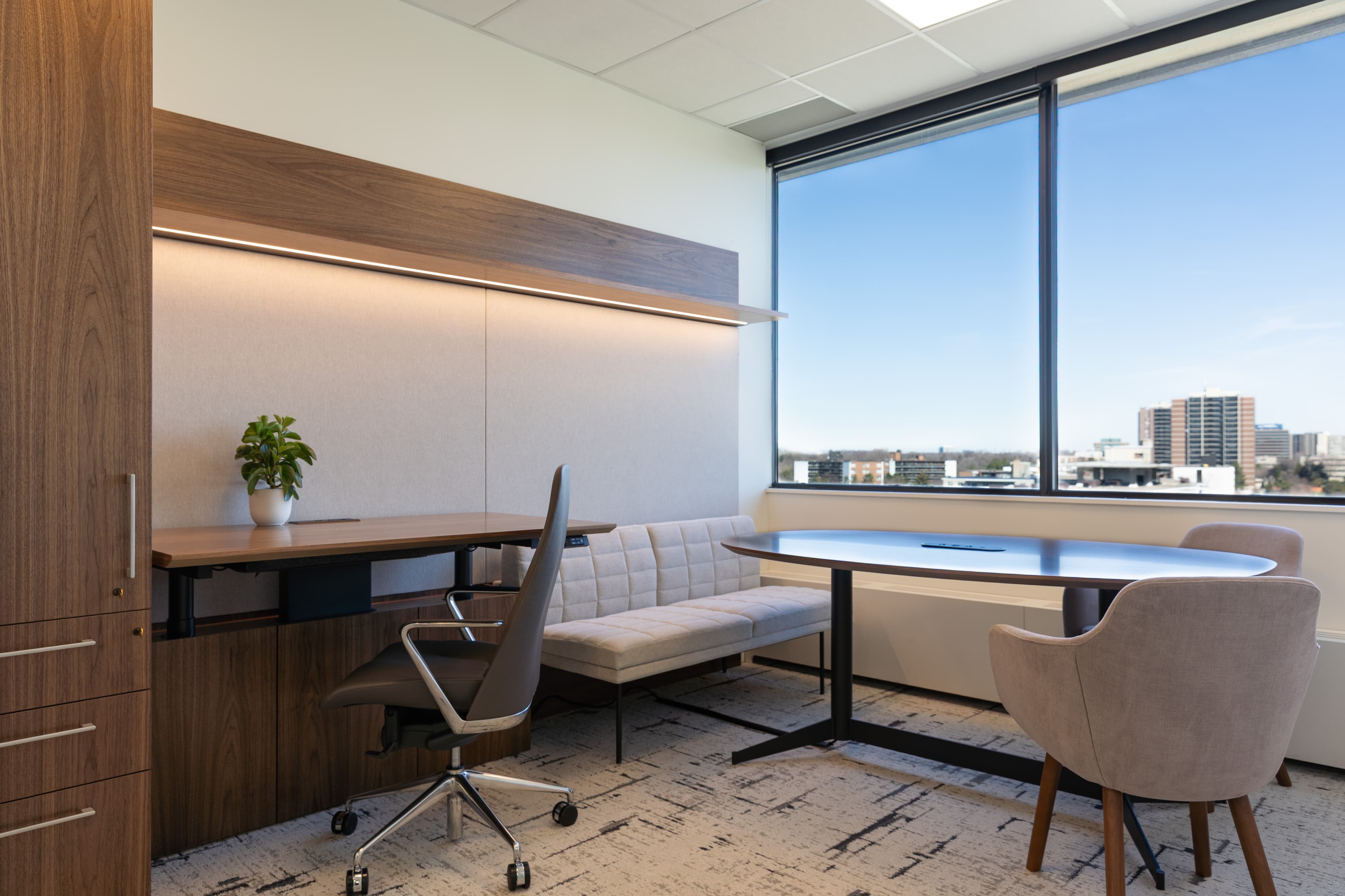 Solo professional private office with desk, window view, and clean setup