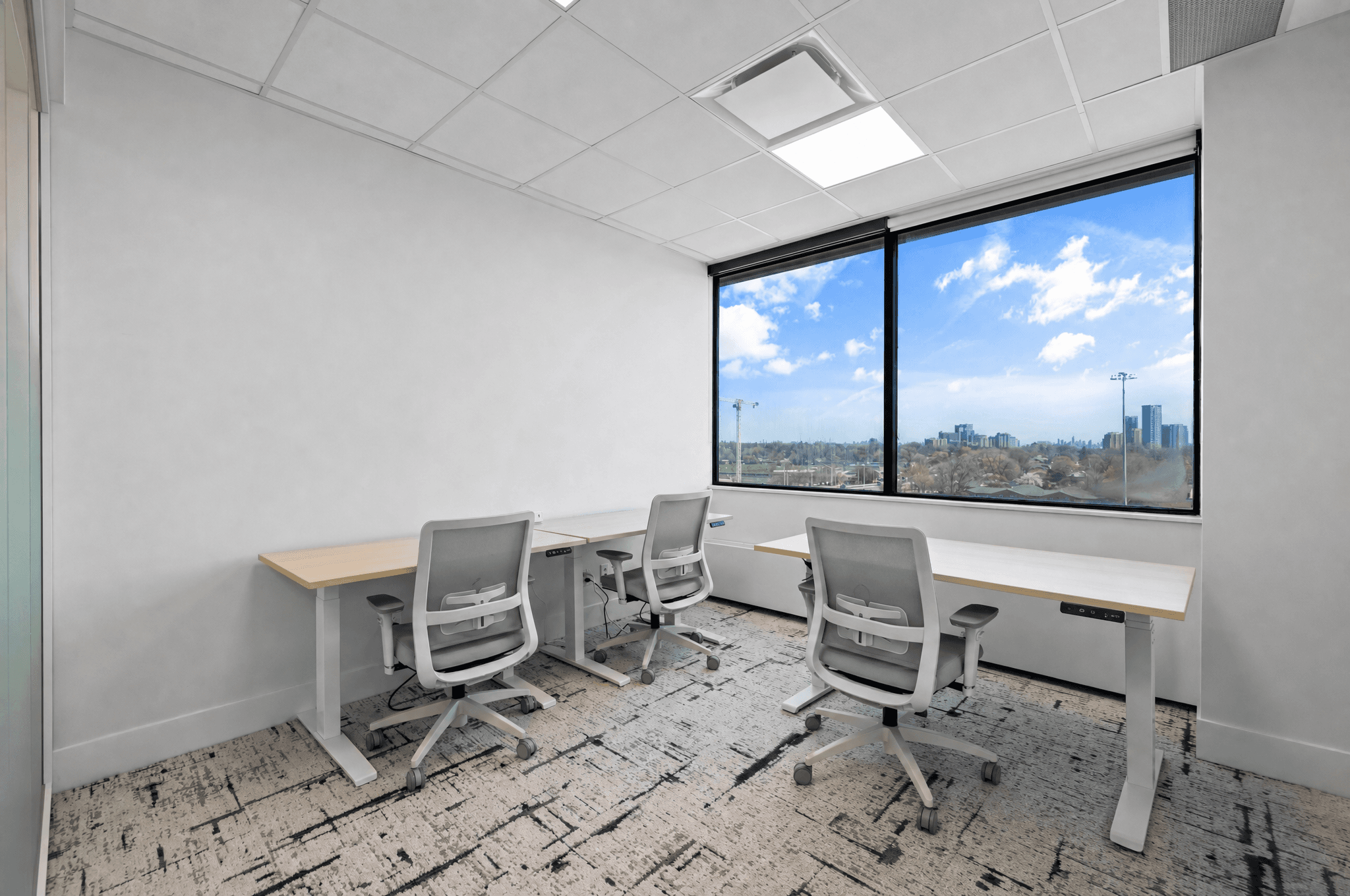 Standard private office at Jilani Place with functional desks and natural light