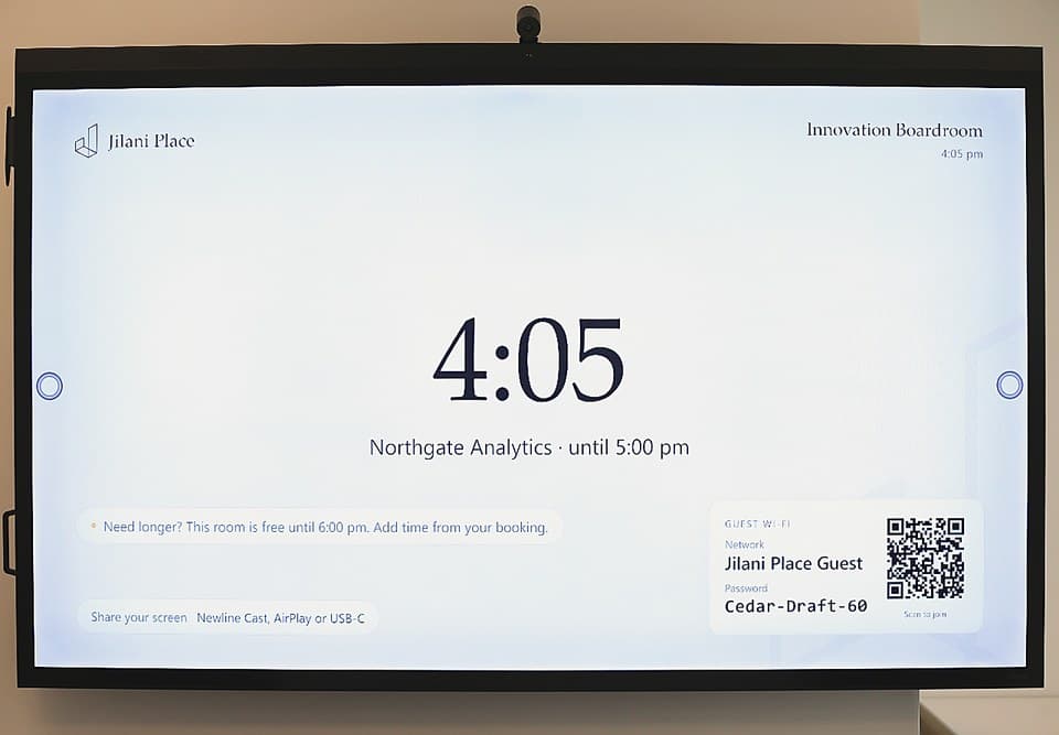 The Innovation Boardroom screen showing the time and who the room is booked to