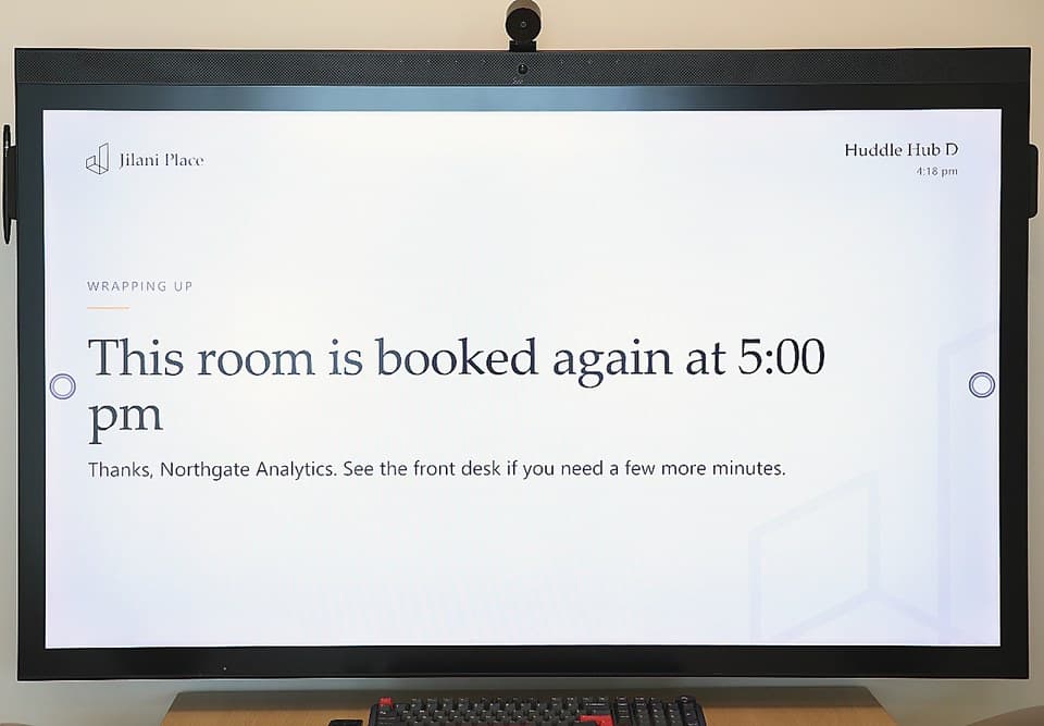 The Huddle Hub screen saying the room is booked again at five o'clock