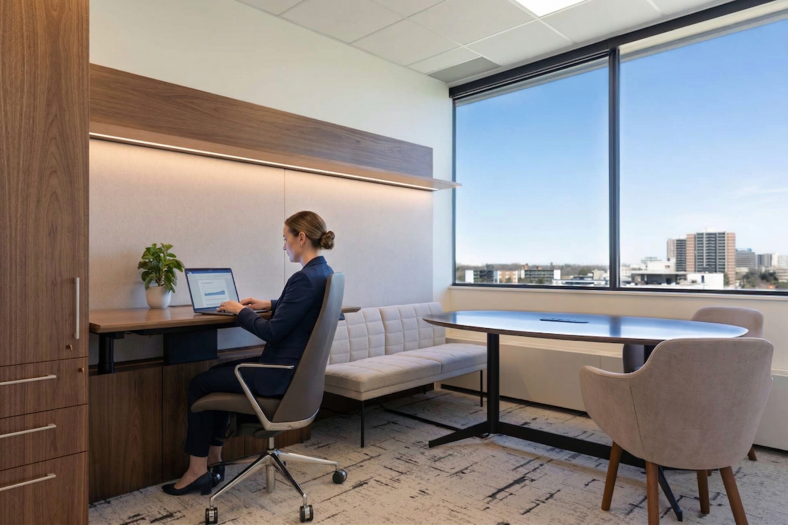 Independent professional working at a dedicated desk with a clean, professional background